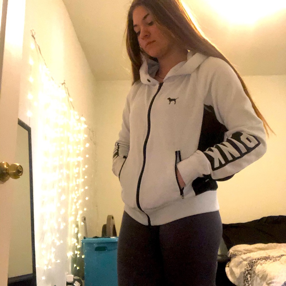 PINK jacket with zip up pockets, size small.